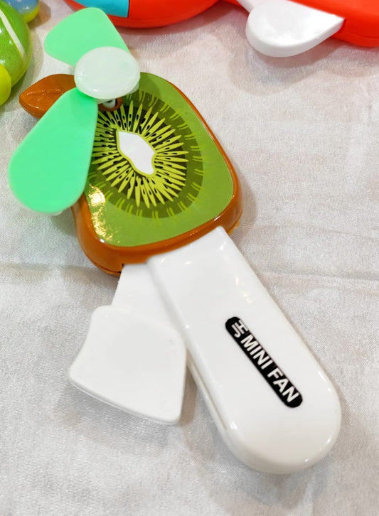 Colorful mini fans on a textured surface with a sunflower decoration.